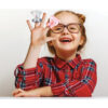 Back to school. Funny little girl with glasses points finger up. Education concept. Gray background Peekaboo Learning Farm